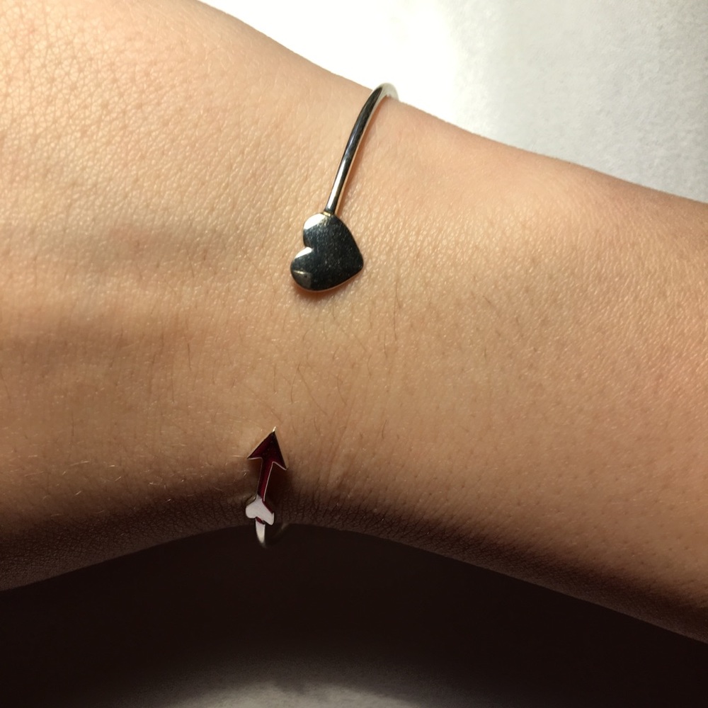 Silver heart and arrow bracelet.